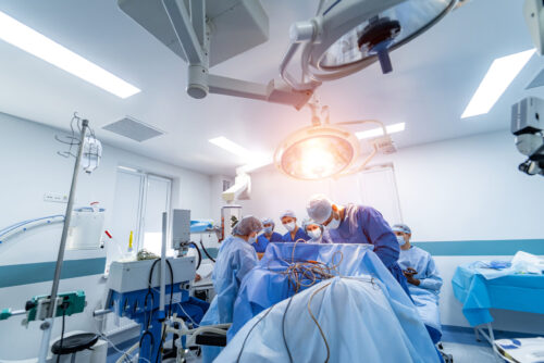 Surgical room in hospital with robotic technology equipment, machine arm surgeon in futuristic operation room. Minimal invasive surgical innovation, medical robot surgery with endoscopy.